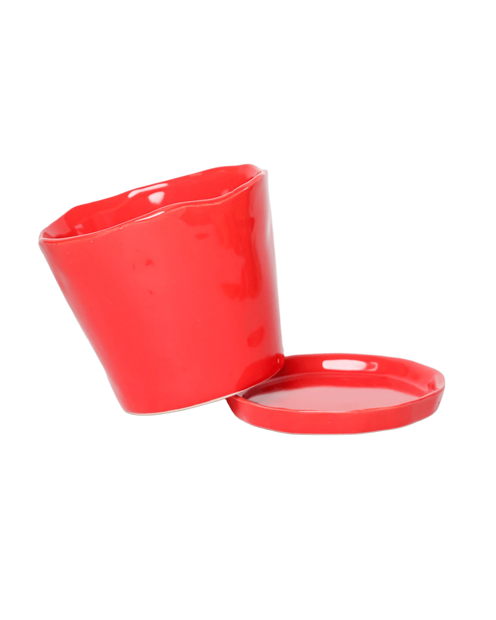 Chive Tika red ceramic large plant pot with drainage tilted to show the detachable saucer.