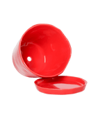 Close-up of the detachable saucer and drainage hole on a Chive Tika red ceramic large pot.