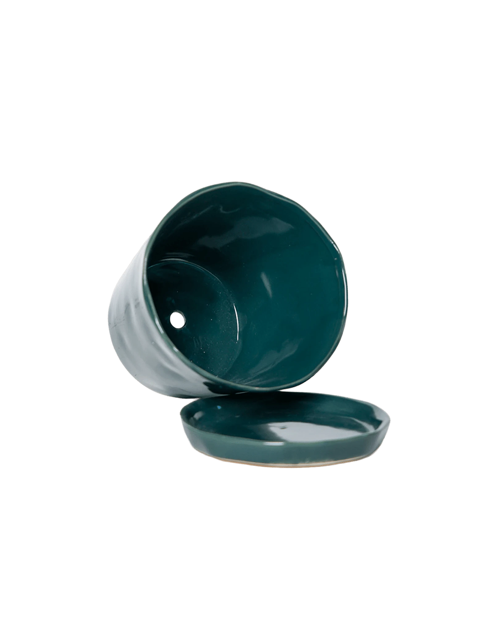 Close-up of the detachable saucer and drainage hole on a Chive Tika spruce ceramic large pot.