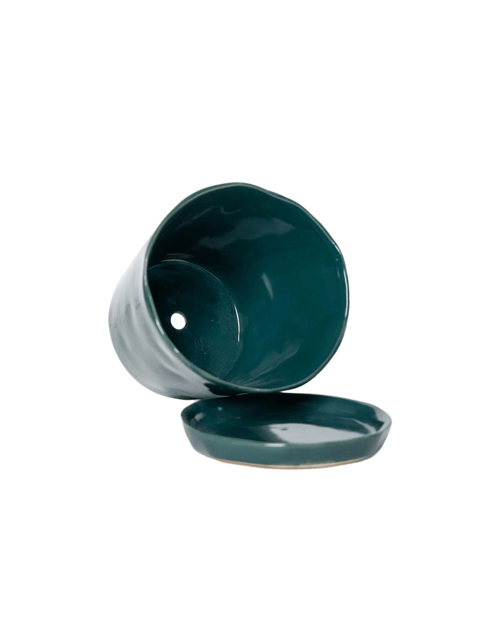 Close-up of the detachable saucer and drainage hole on a Chive Tika spruce ceramic large pot.