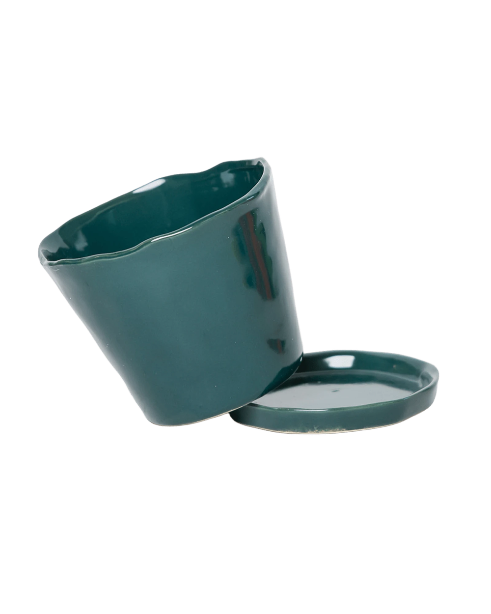 Close-up of the detachable saucer and drainage hole on a Chive Tika spruce ceramic medium pot.