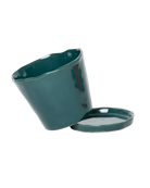 Close-up of the detachable saucer and drainage hole on a Chive Tika spruce ceramic pot.