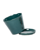 Close-up of the detachable saucer and drainage hole on a Chive Tika spruce ceramic pot.