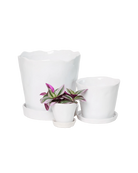 Chive Tika white glazed ceramic planters in small, medium and large sizes with drainage and saucers, styled with a plant.