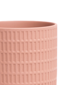 Close-up of the Chive Virago A medium clay terracotta porcelain pot showing the color and textured finish.