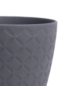 Close-up of the Chive Virago B small black porcelain pot showing the color and textured finish.