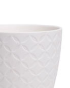 Close-up of the Chive Virago B small white porcelain pot showing the color and textured finish.