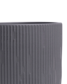 Close-up of the Chive Virago C medium black porcelain pot showing the color and ribbed texture finish.