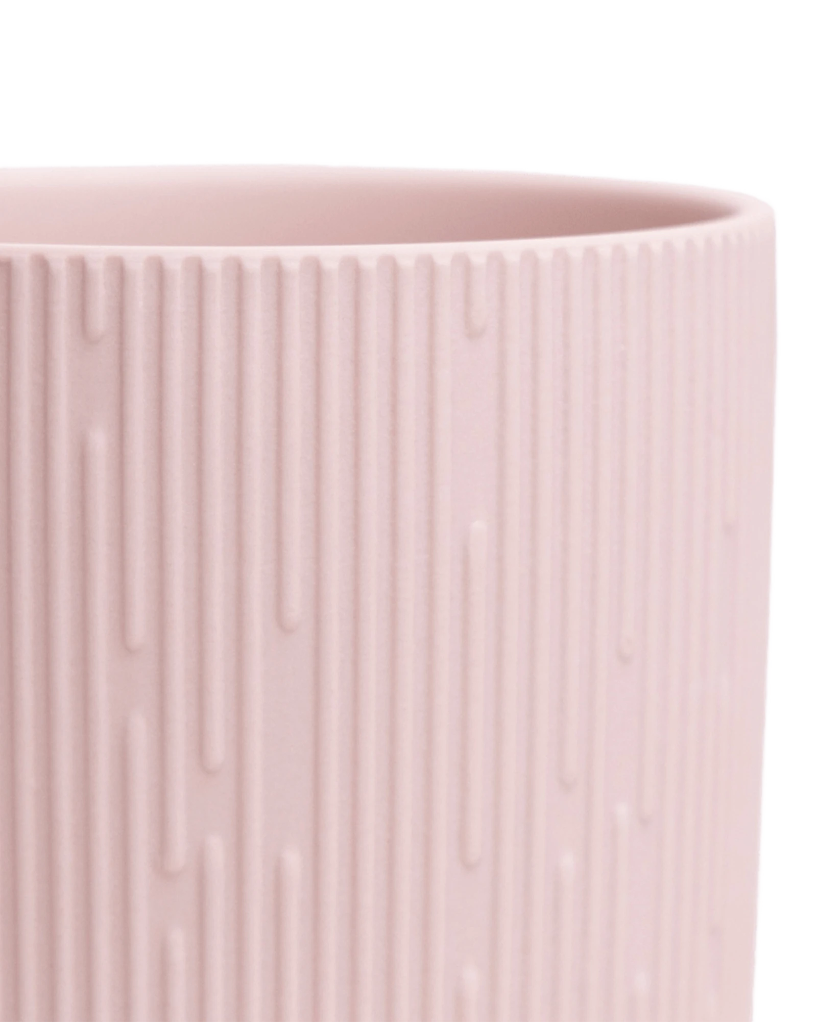 Close-up of the Chive Virago C small soft pink porcelain pot showing the color and ribbed texture finish.