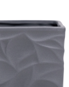 Close-up of the Chive Virago D medium black porcelain pot showing the color and geometric texture.