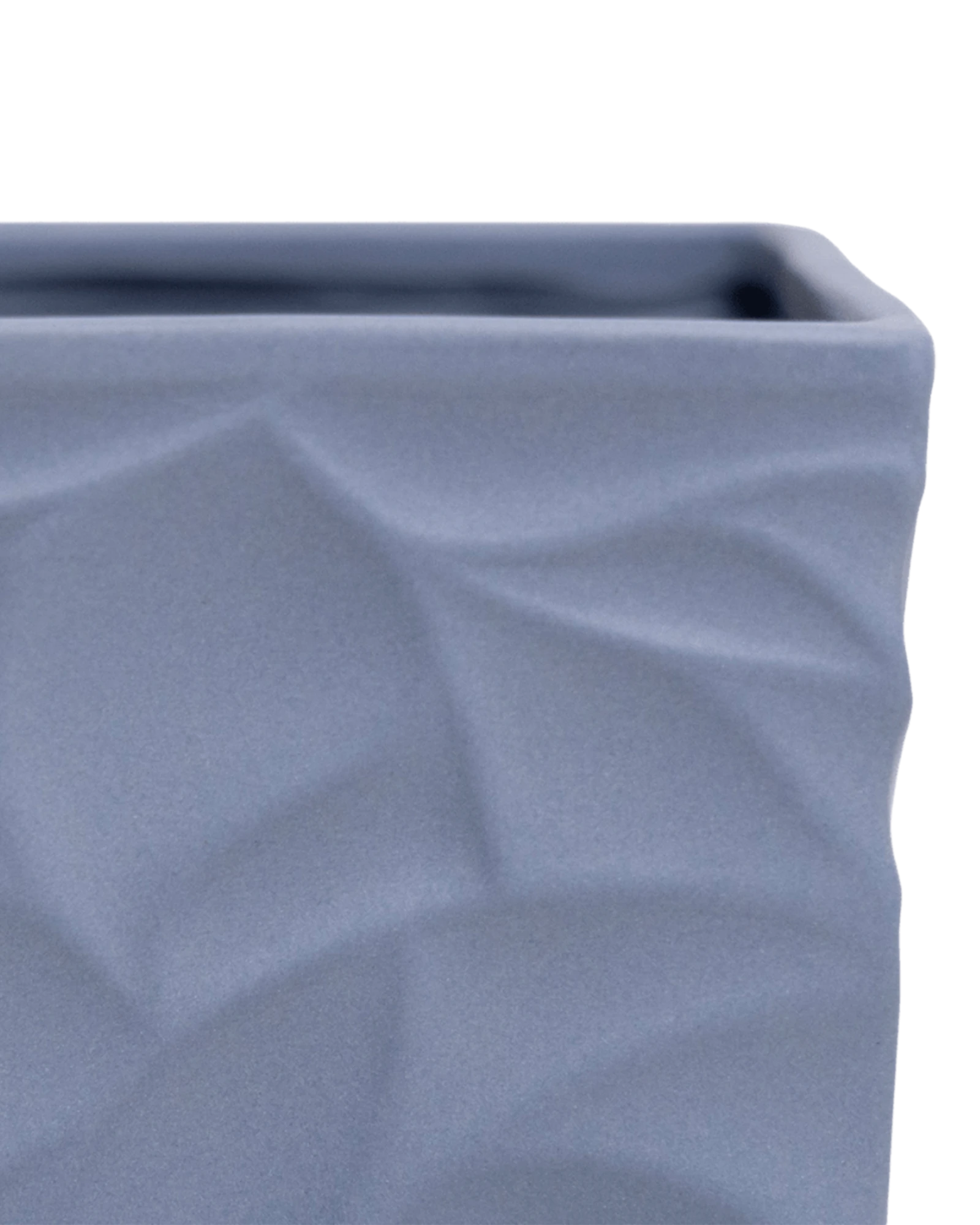 Close-up of the Chive Virago D medium blue grey porcelain pot showing the color and geometric texture.