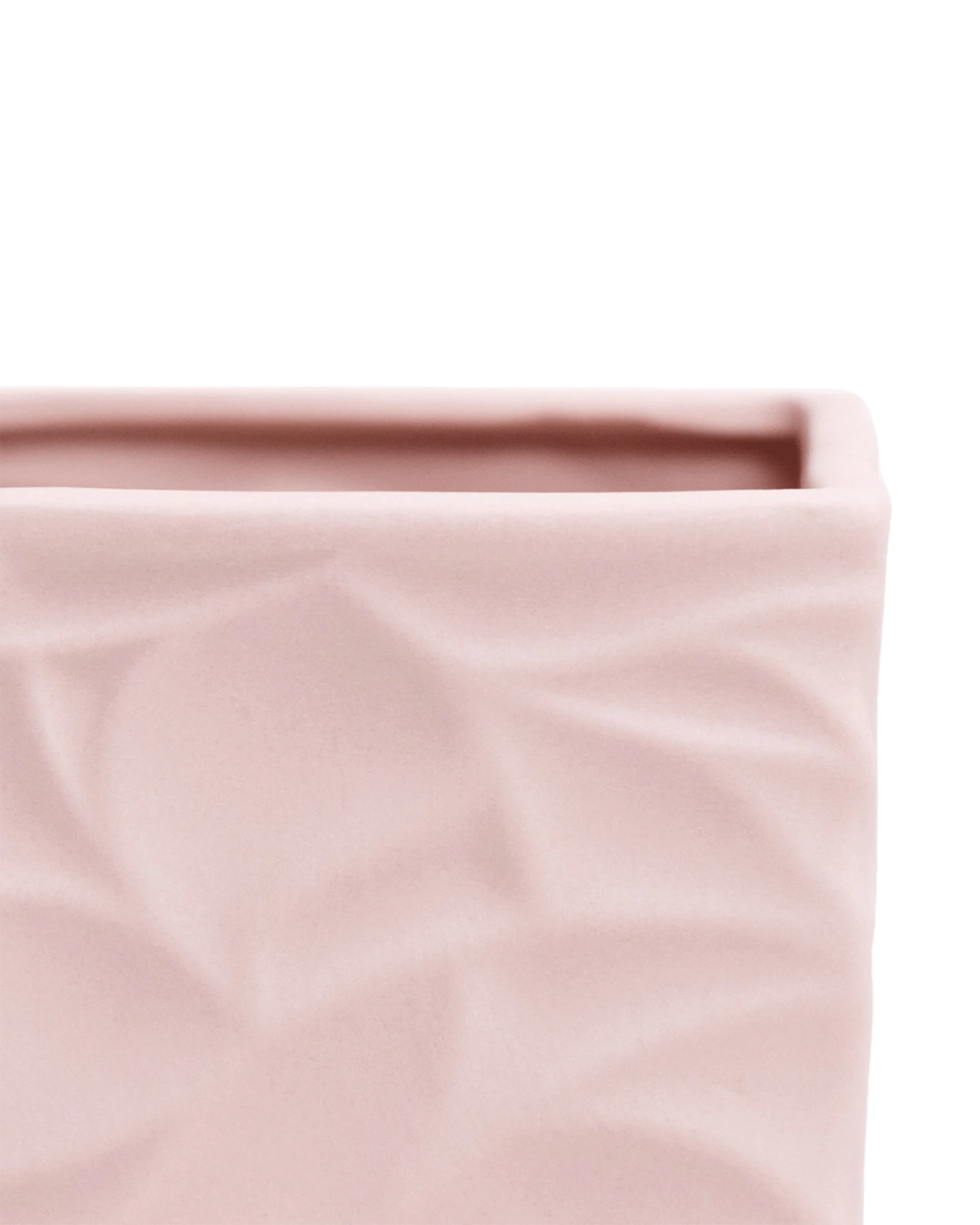 Close-up of the Chive Virago D medium soft pink porcelain pot showing the color and geometric texture.
