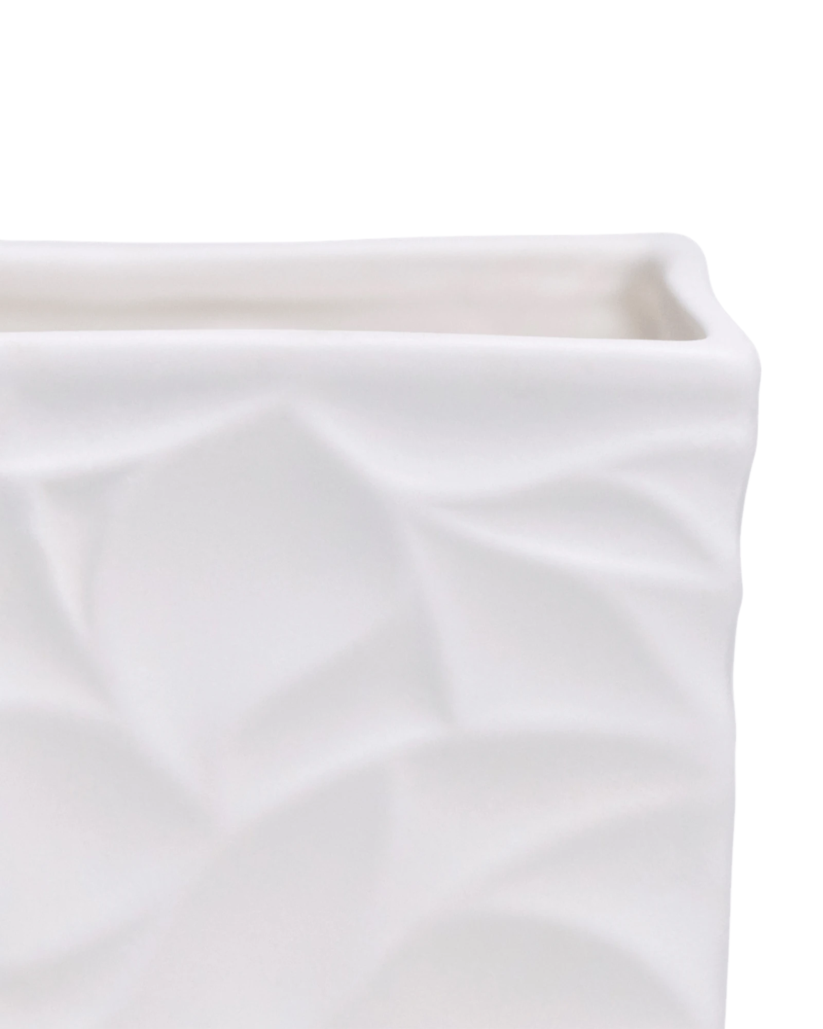 Close-up of the Chive Virago D small white porcelain pot showing the color and geometric texture.