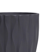 Close-up of the Chive Virago E small black porcelain pot showing the color and textured finish.