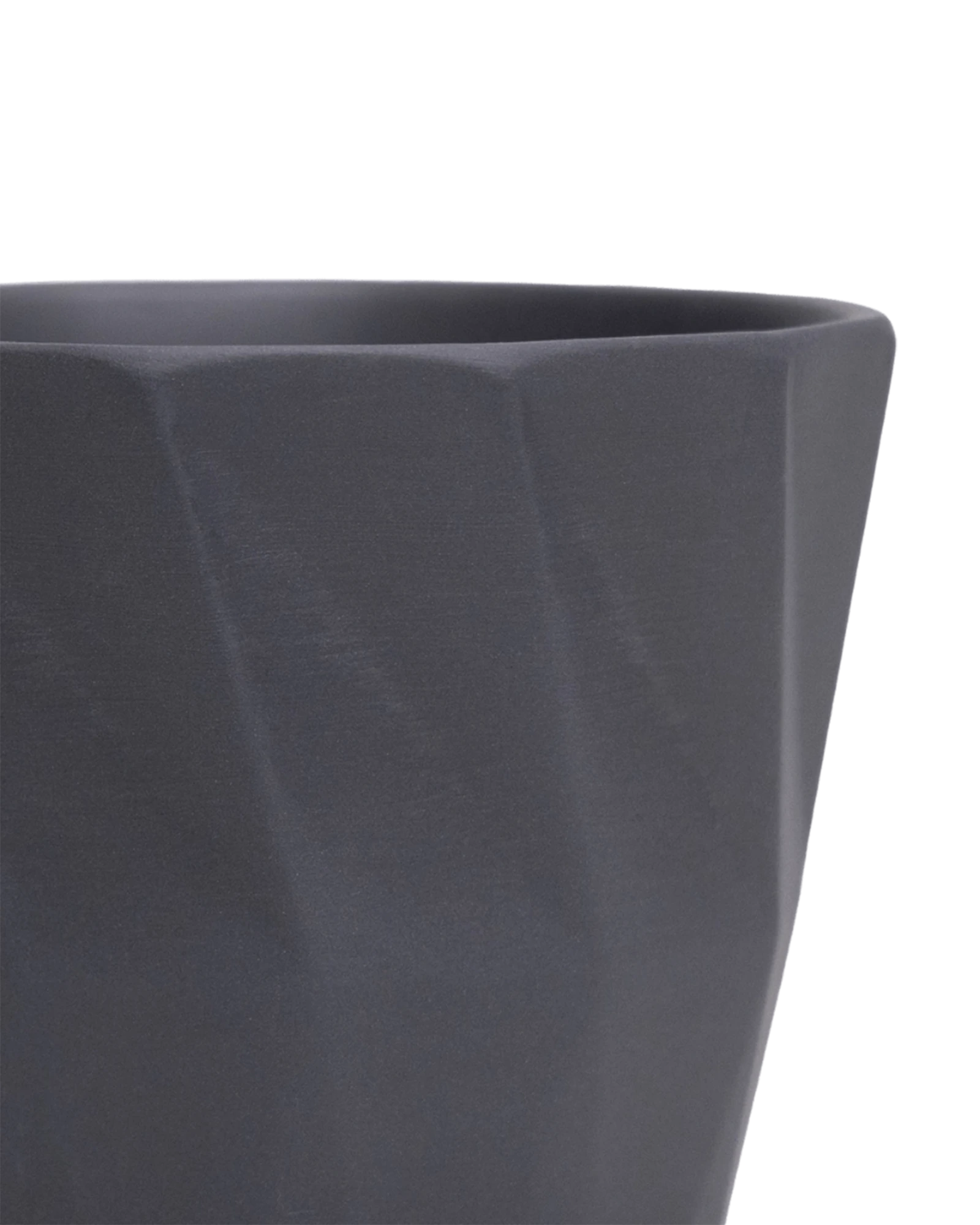 Close-up of the Chive Virago G small black porcelain pot showing the color and geometric texture.