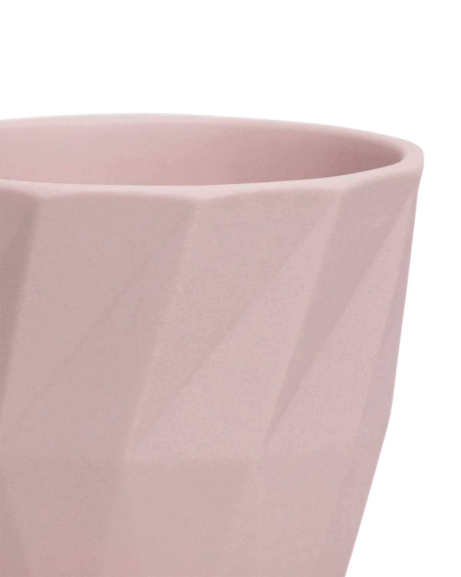 Close-up of the Chive Virago G medium soft pink porcelain pot showing the color and geometric texture.