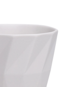Close-up of the Chive Virago G small white porcelain pot showing the color and geometric texture.