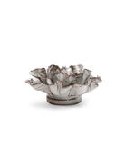 A sculptural ceramic lotus flower bowl with a textured, weathered finish in off-white and gray with subtle reddish-brown accents along the petal edges, set against a plain white background.