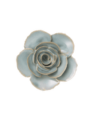 A ceramic succulent-style flower figurine with pale blue-green glazed petals and natural clay edges, photographed from directly above on a plain white background.
