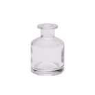 Chive Loft apothecary glass bud vase in clear glass with a tall cylindrical silhouette and wide lip.