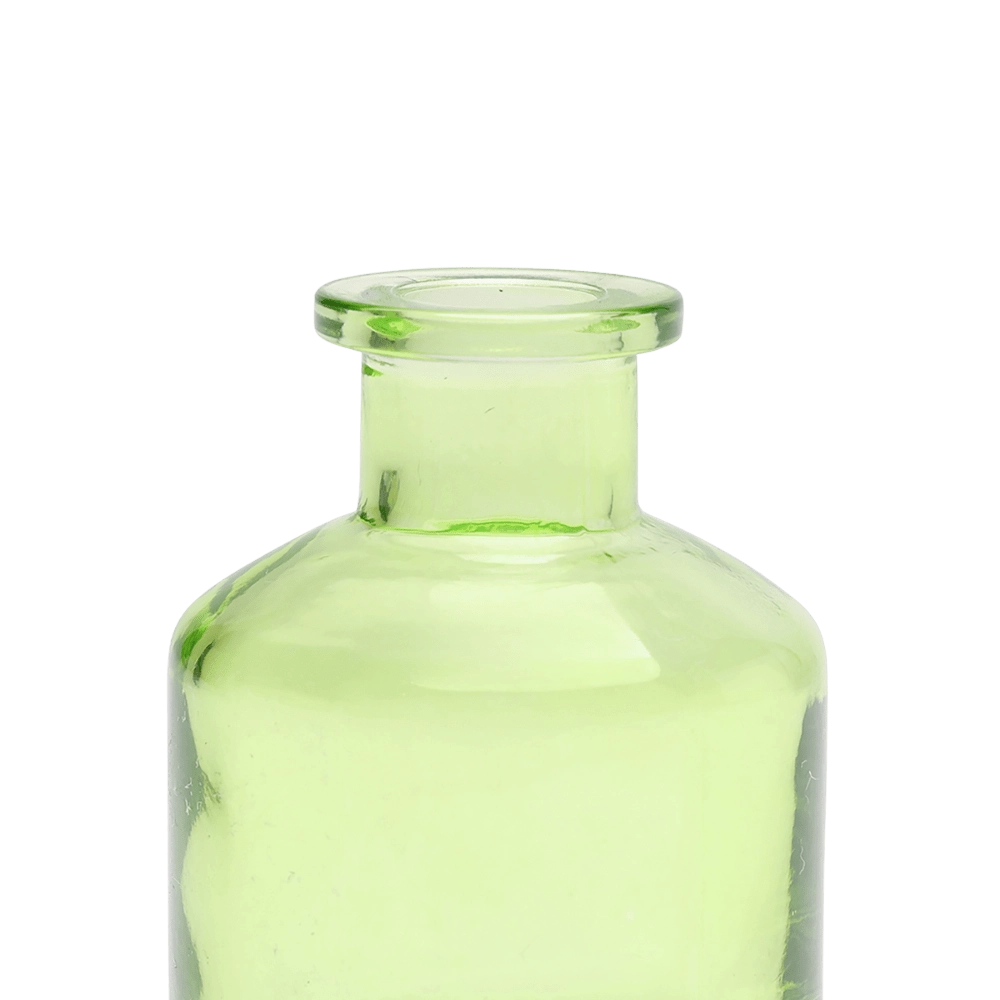 Chive Loft apothecary glass bud vase in green, close-up on the wide flared lip.