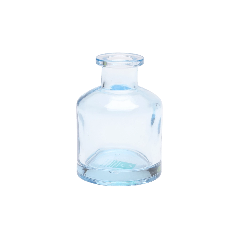 Chive Loft apothecary glass bud vase in light blue with a tall cylindrical silhouette and wide lip.