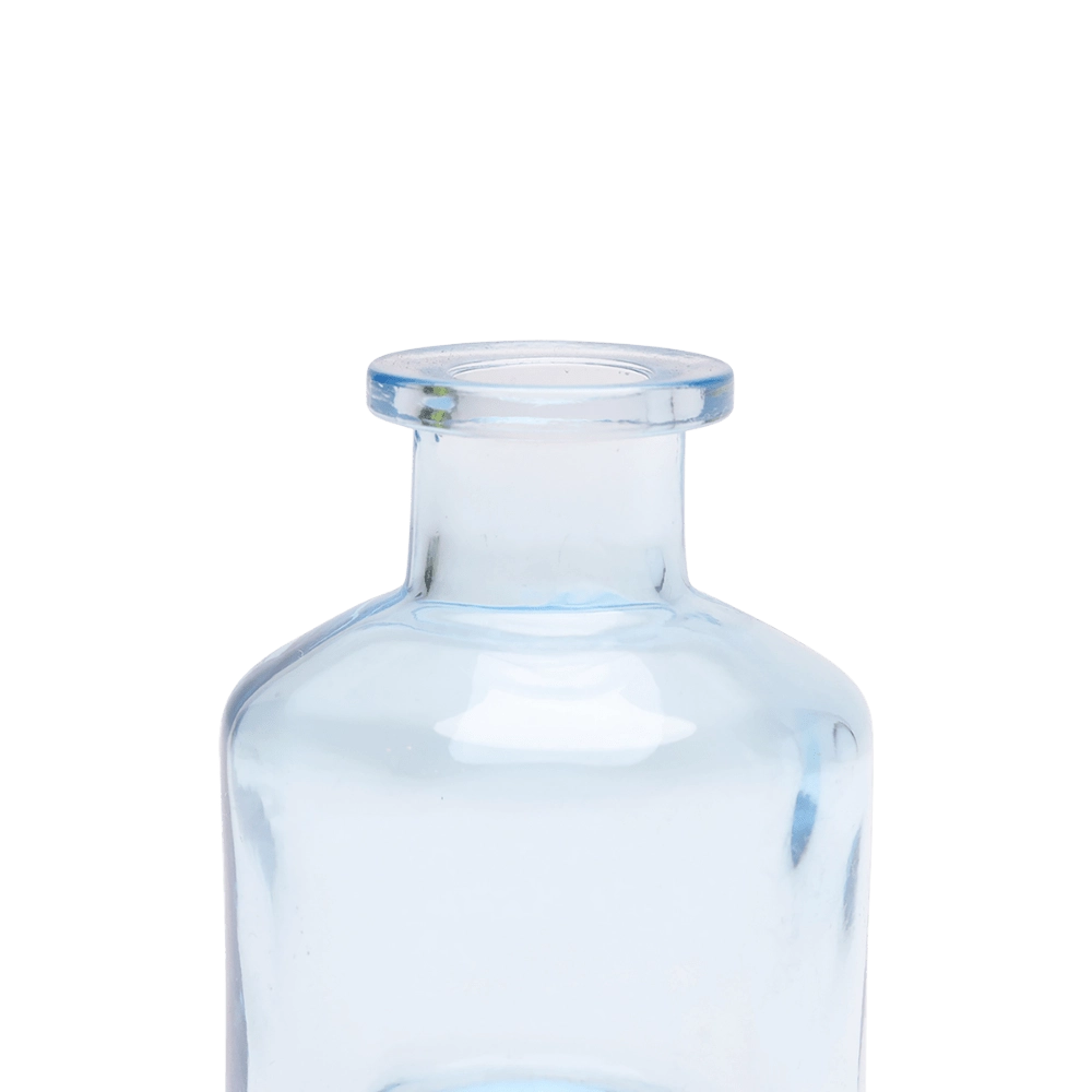 Chive Loft apothecary glass bud vase in light blue, close-up on the wide flared lip.