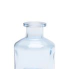 Chive Loft apothecary glass bud vase in light blue, close-up on the wide flared lip.