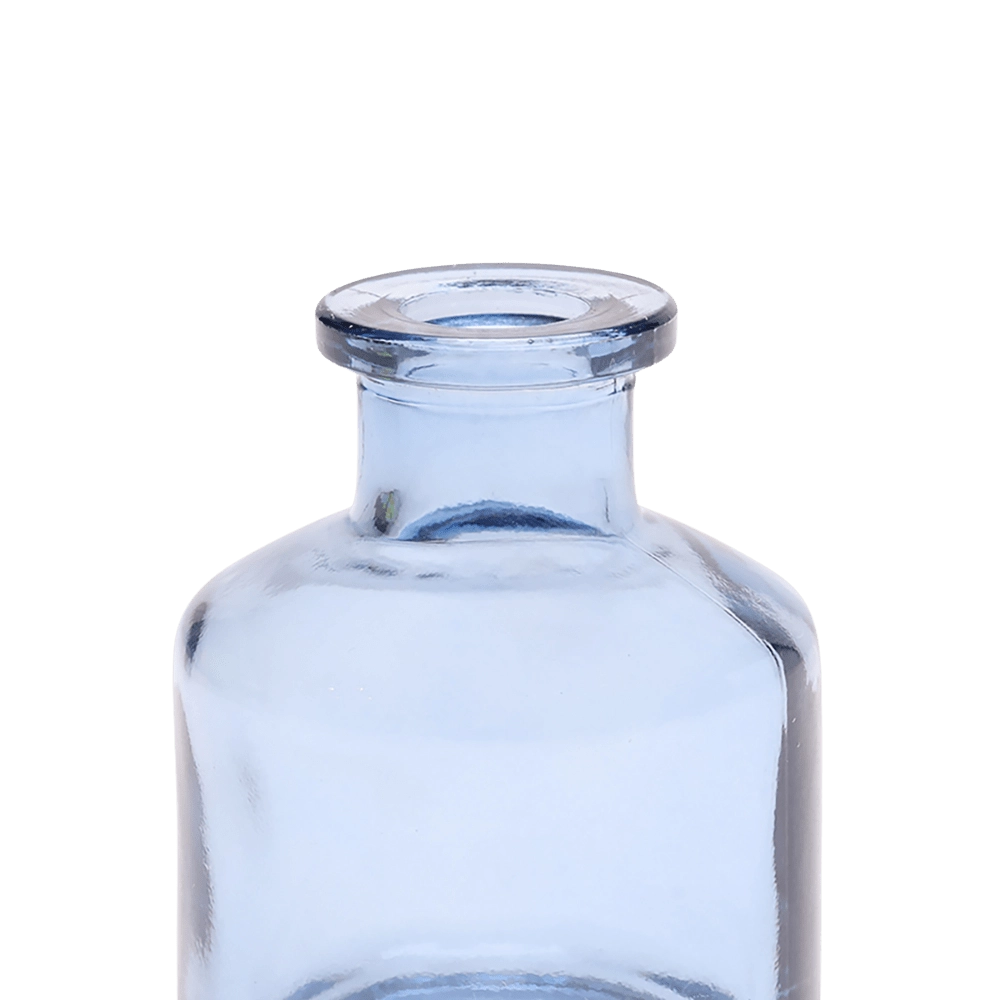 Chive Loft apothecary glass bud vase in medium blue, close-up on the wide flared lip.