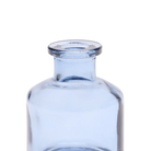 Chive Loft apothecary glass bud vase in medium blue, close-up on the wide flared lip.
