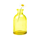 Chive Loft glass bud vase in yellow styled with a single white daisy bloom.