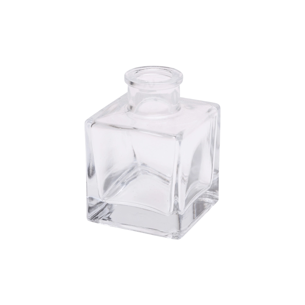 Chive Loft cube glass bud vase in clear glass, shown at an angle with a glossy faceted finish.