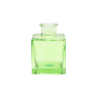 Chive Loft cube glass bud vase in green, straight-on view highlighting the sharp square edges.