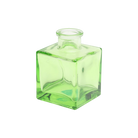 Chive Loft cube glass bud vase in green, straight-on view highlighting the sharp square edges.