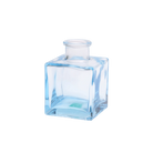 Chive Loft cube glass bud vase in light blue with a raised collar neck and clean square silhouette.