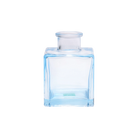 Chive Loft cube glass bud vase in light blue, straight-on view highlighting the sharp square edges.