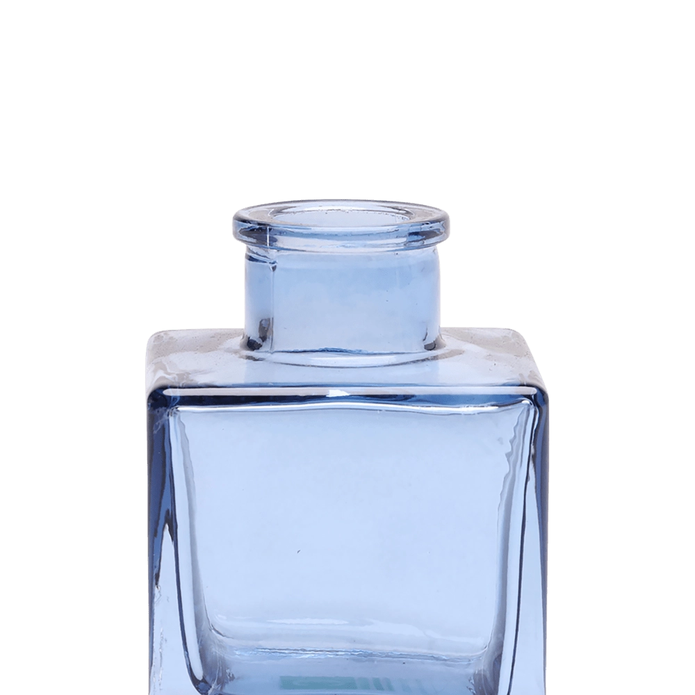 Chive Loft cube glass bud vase in medium blue, close-up on the raised collar neck.
