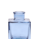 Chive Loft cube glass bud vase in medium blue, close-up on the raised collar neck.