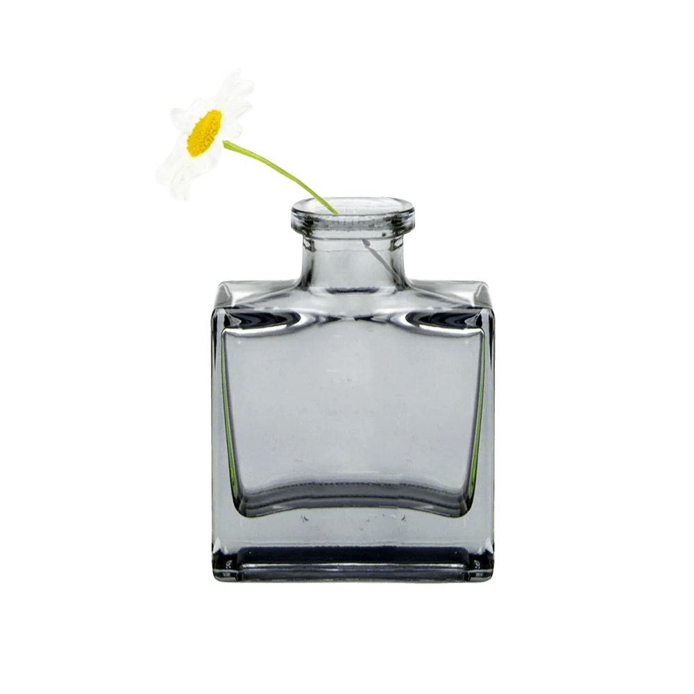 Chive Loft cube glass bud vase in smoke grey styled with a single white daisy bloom.