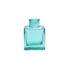 Chive Loft cube glass bud vase in teal with a raised collar neck and clean square silhouette.