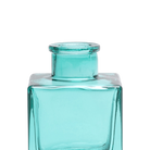 Chive Loft cube glass bud vase in teal, close-up on the raised collar neck.