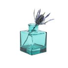 Chive Loft cube glass bud vase in teal styled with a single blue thistle stem.