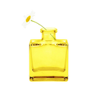 Chive Loft cube glass bud vase in yellow styled with a single white daisy bloom.
