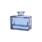 Chive Loft square glass bud vase in blue-grey, shown straight-on with a glossy faceted finish.