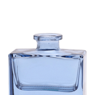 Chive Loft square glass bud vase in blue-grey, close-up on the narrow neck and thick glass base.