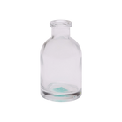 Chive Loft tall glass bud vase in clear glass with a slender neck and rounded shoulder.