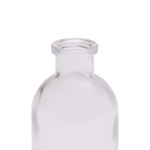 Chive Loft tall glass bud vase in clear glass, close-up on the narrow neck and rim.