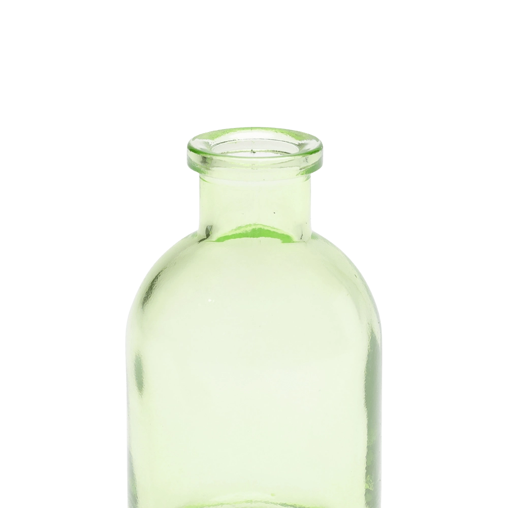 Chive Loft tall glass bud vase in green, close-up on the narrow neck and rim.