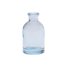 Chive Loft tall glass bud vase in light blue, shown straight-on with a smooth glossy finish.