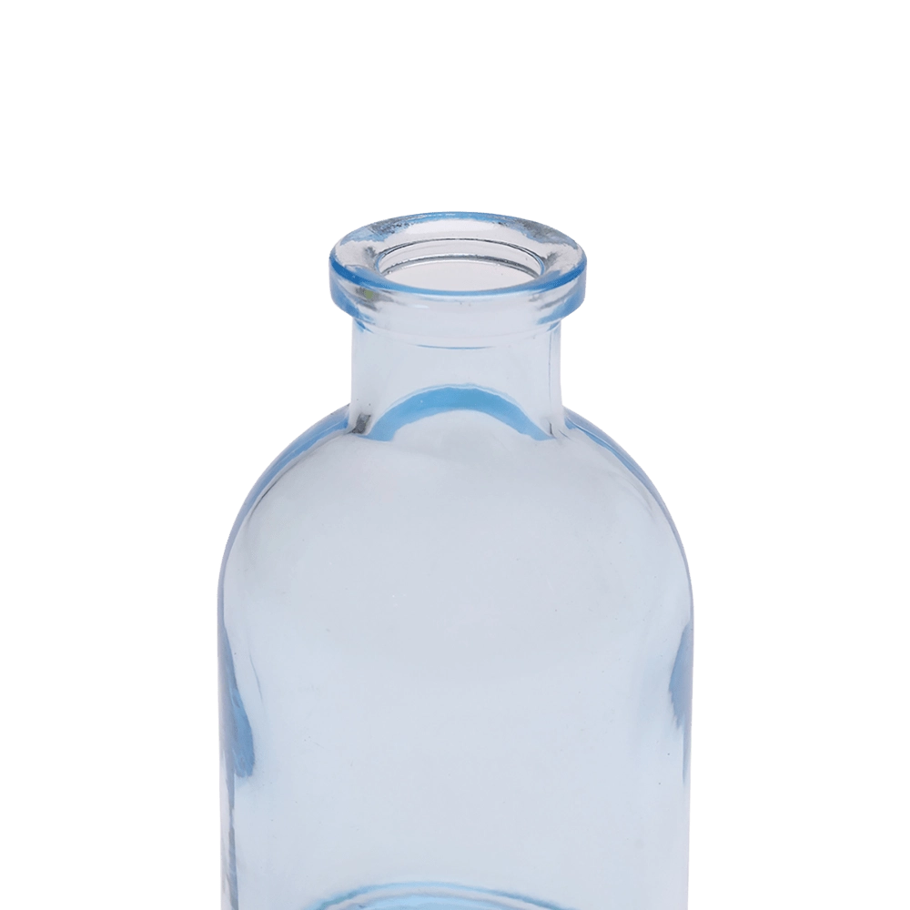 Chive Loft tall glass bud vase in light blue, close-up on the narrow neck and rim.